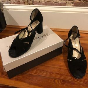 Black strappy with a low heel, lightly worn